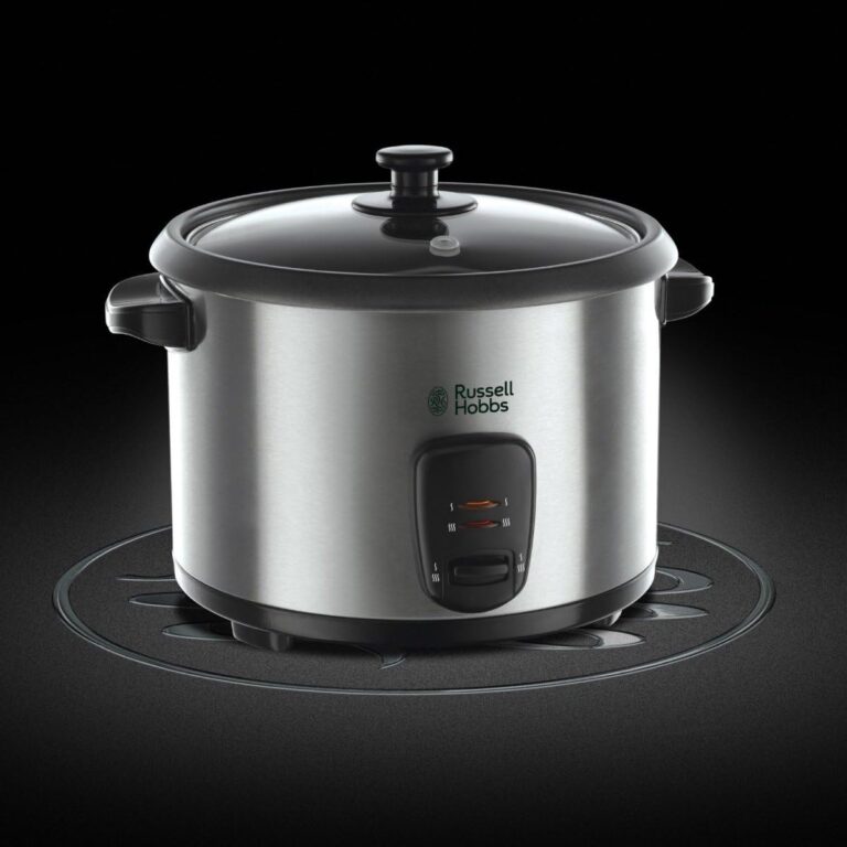 Arrocera Russell Hobbs Cook@Home de 1.8L, color gris acero, con tapa de vidrio y bandeja de vapor, cocinando arroz esponjoso perfecto para comidas latinas